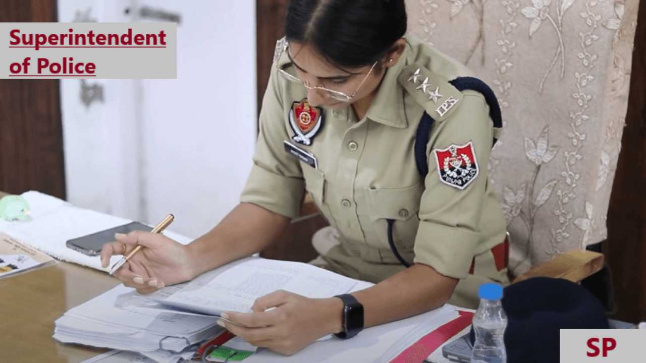 Lady SP sitting on chair and checking files